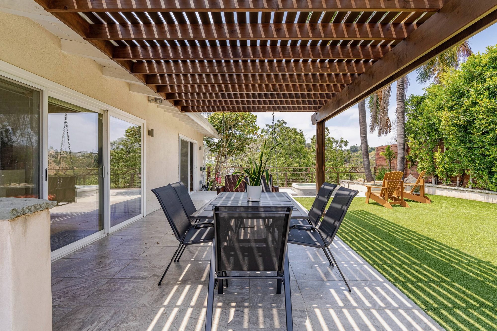 View through sliding glass door into kitchen and dining room