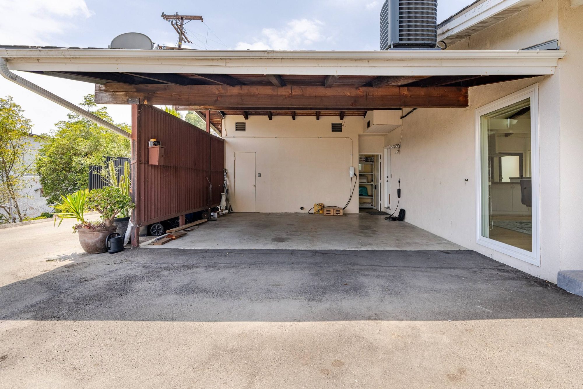 Covered carport beside the house