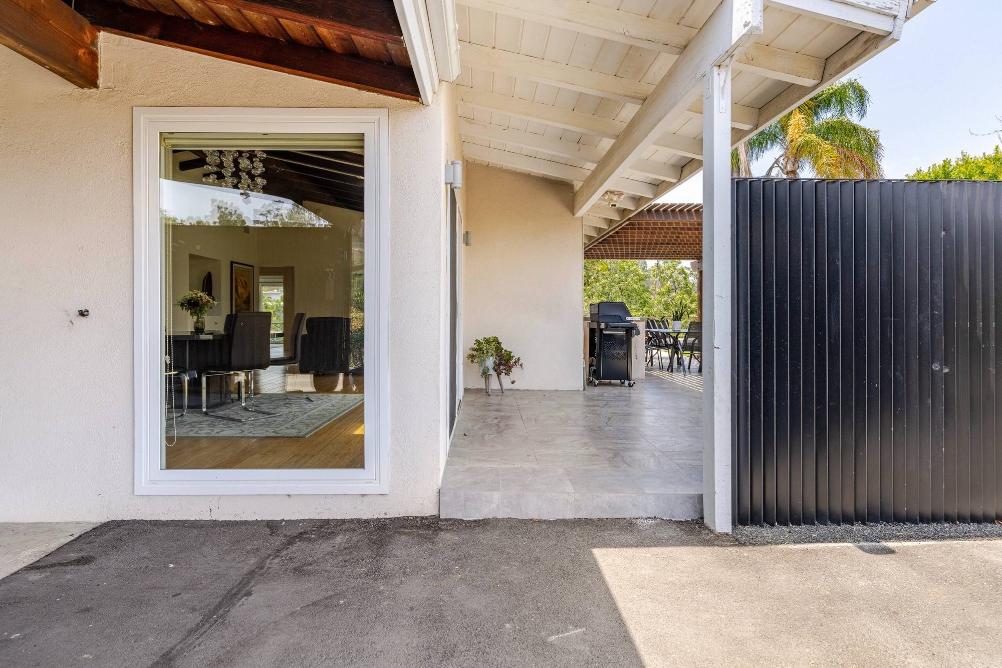 Empty carport bay beside the house