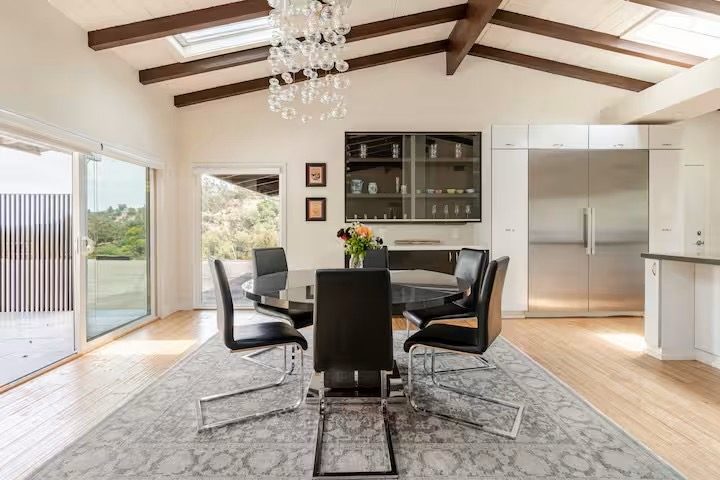 Dining nook with glass table and built-in bench seating