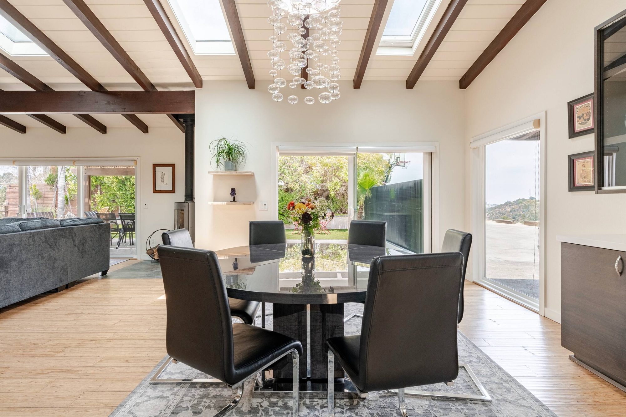 Living room and dining area with grey sectional sofa