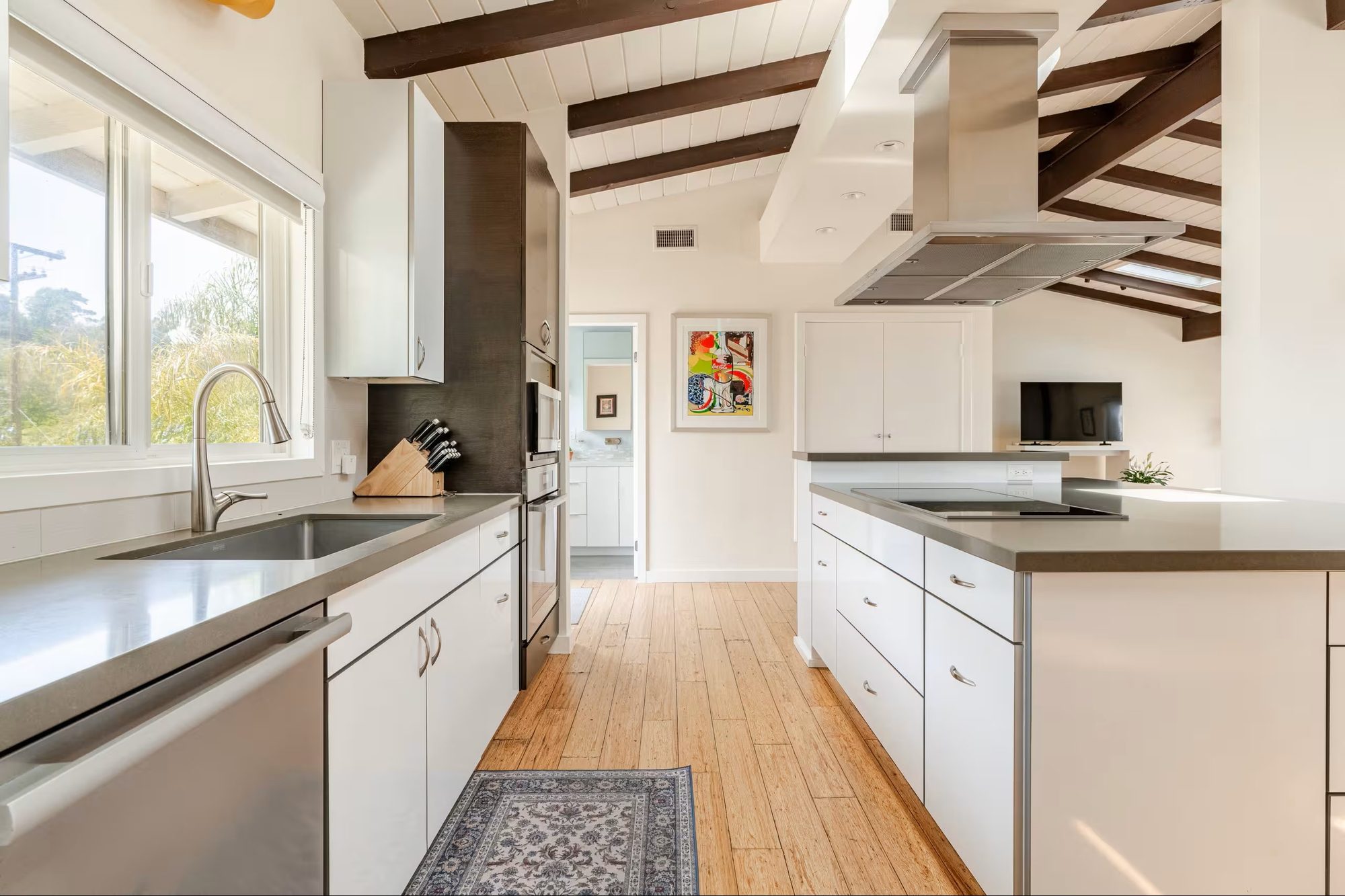 Kitchen sink and window with knife block and built-in oven column