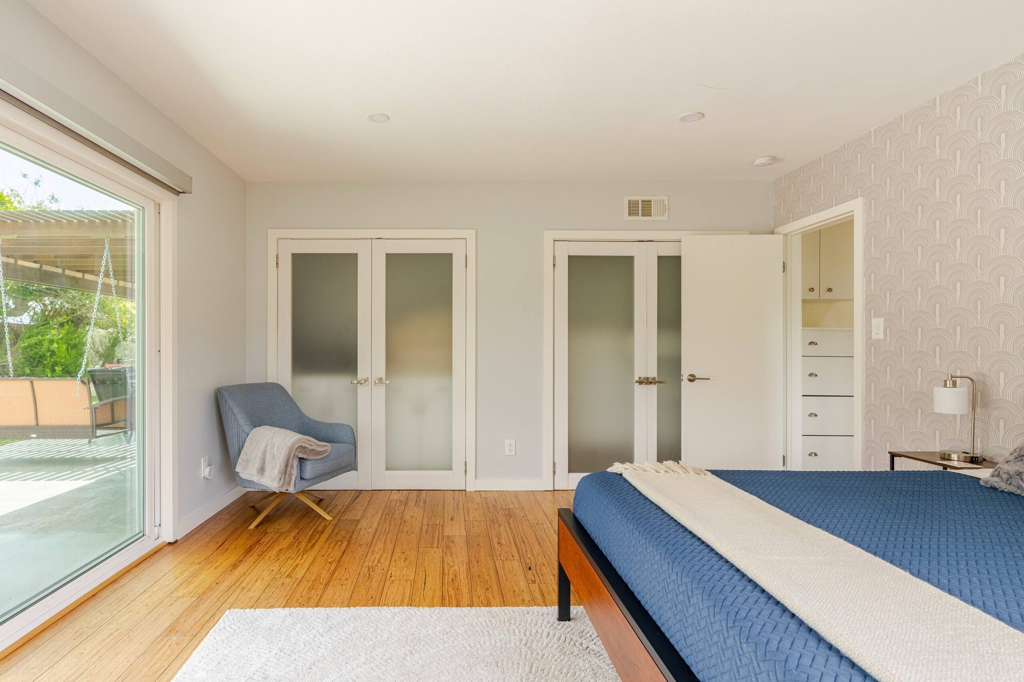 Primary bedroom double closets with drawers and hanging space